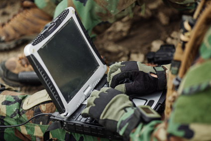 ranger using laptop outdoors